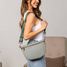Load image into Gallery viewer, Woman holding a checkered handbag with a green strap against a neutral background