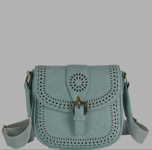 Light blue handbag with perforated design on a gray background