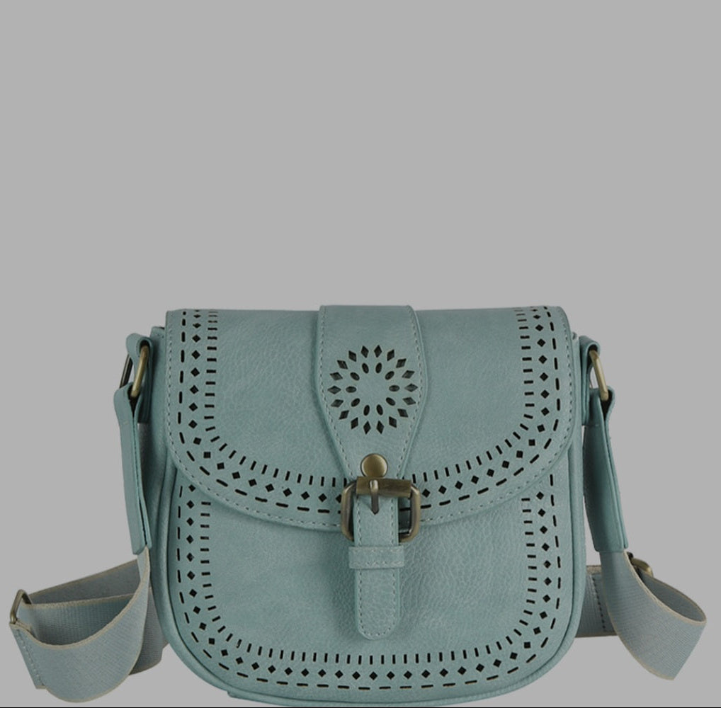 Light blue handbag with perforated design on a gray background