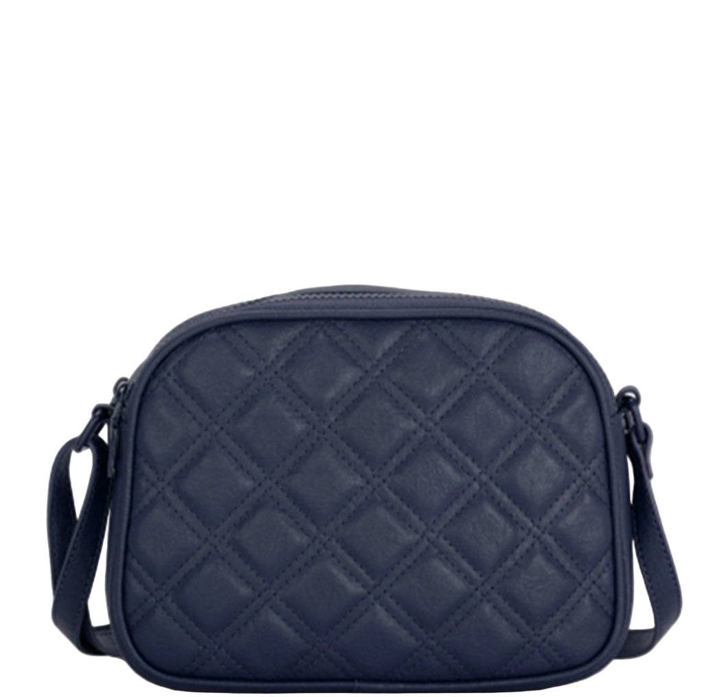 Navy blue quilted crossbody bag on a gray background