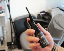 Load image into Gallery viewer, The Good SH*T Volumizing Dust Powder for Men in a salon
